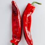 Close-up of fresh, hot red chili peppers showcasing vibrant color and spicy potential.